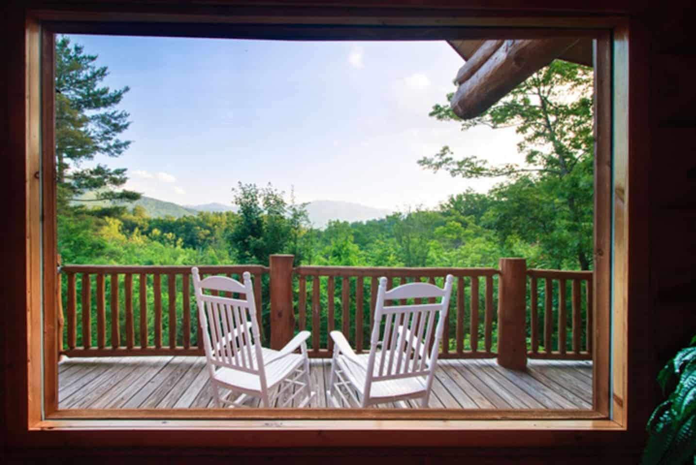 Rocking chairs on the deck with a view of the Smokies