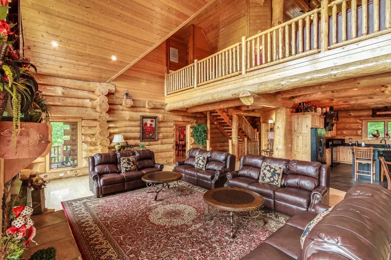 Living room connects to upper deck as well as kitchen and dining areas