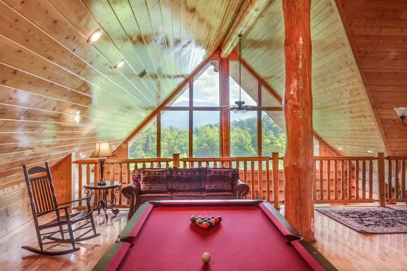 Pool table, TV, and sofas upstairs for entertainment and relaxing.