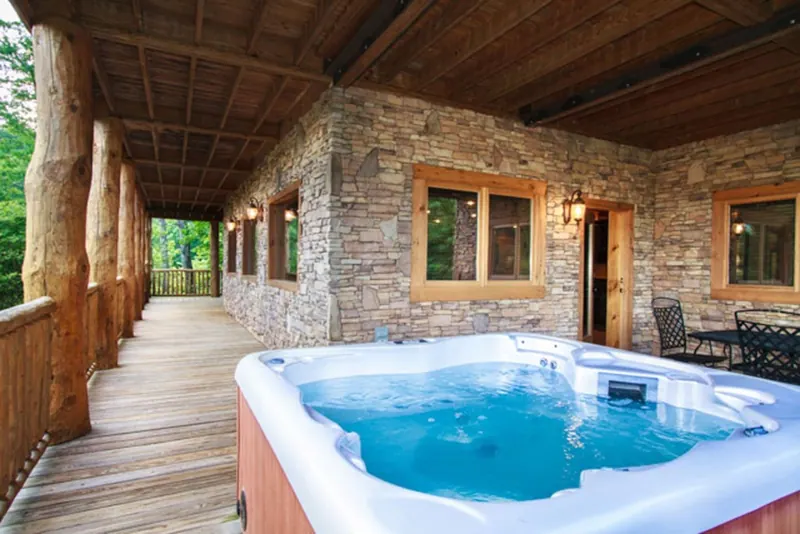 Luxurious 6-person hot tub on the lower deck with views of the Smoky Mountains