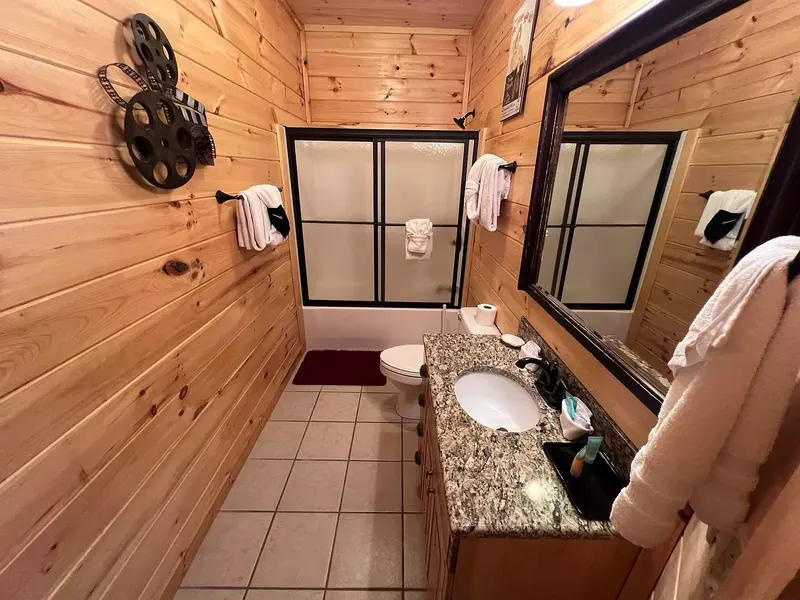 Full bath outside family bedroom with bath tub/shower combo