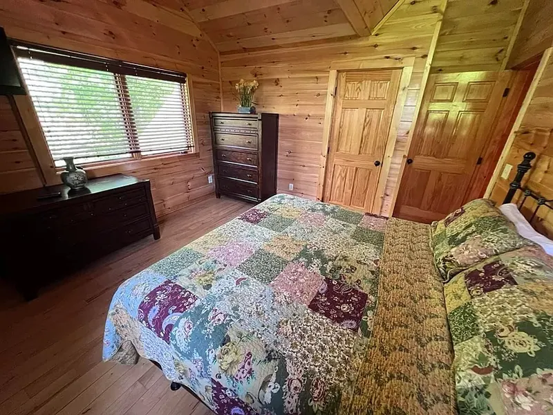 Upstairs King room with full bath outside door.
